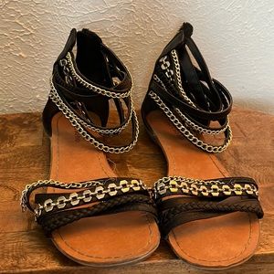 Black sandals with gold chain texture